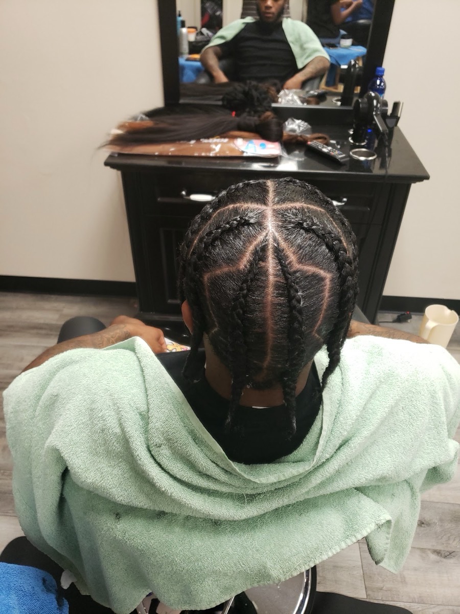 Inside Ngozi Hair Braiding — clean styling station and chair